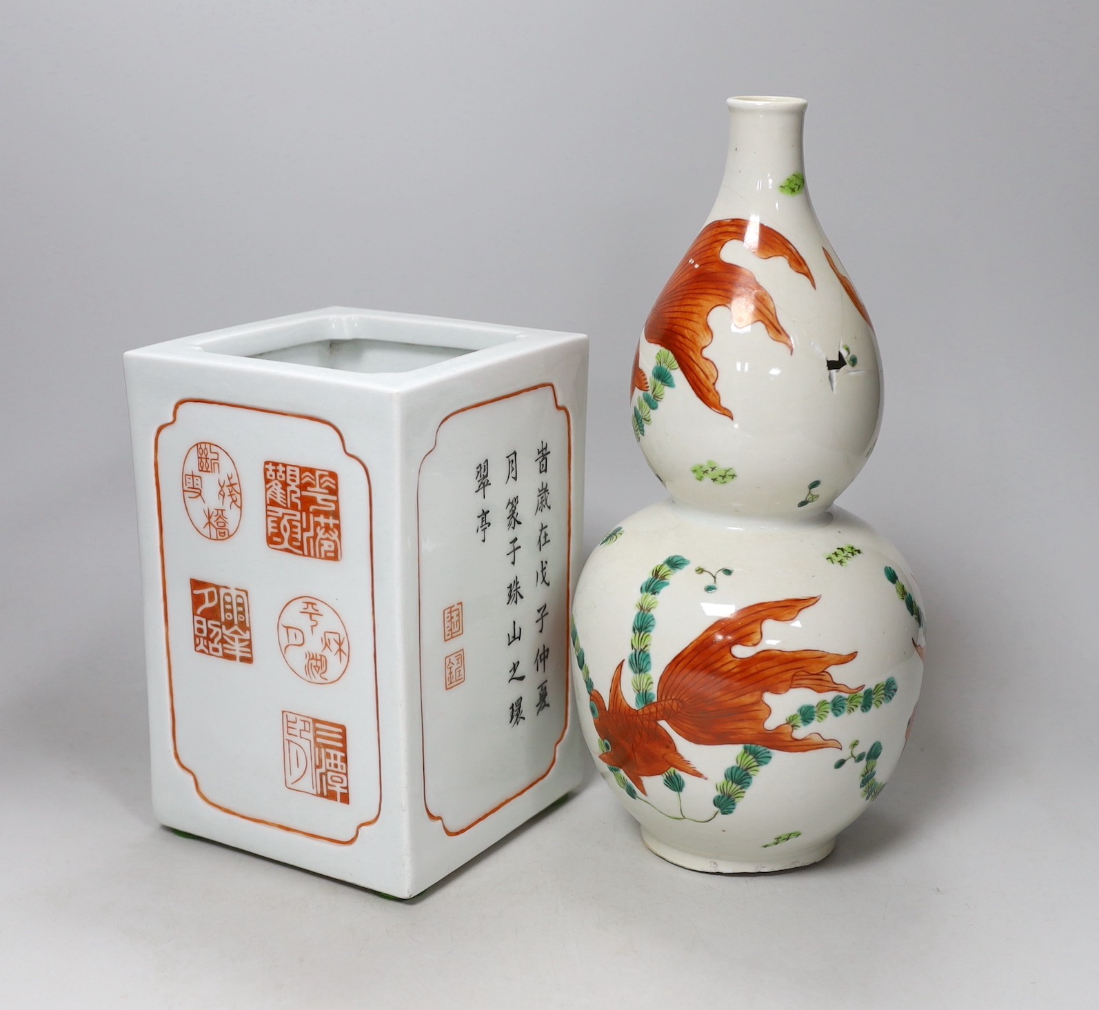 A Chinese iron red and black inscribed square brushpot and a goldfish double gourd vase (a.f.) tallest 29cm